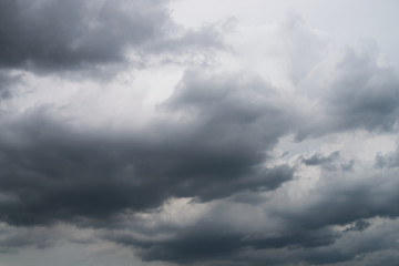 Rain clouds hunk black sky was overcast in the rainy season.