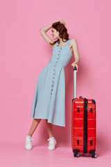 girl in a dress with suitcase