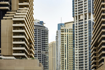 Fototapeta premium Close-up view of some modern buildings and skyscrapers in Dubai. Dubai is the largest city in the United Arab Emirates (UAE) and the capital of the Emirate of Dubai.
