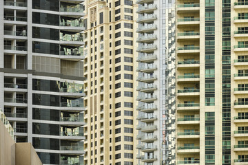 Naklejka premium Close-up view of some modern buildings and skyscrapers in Dubai. Dubai is the largest city in the United Arab Emirates (UAE) and the capital of the Emirate of Dubai.