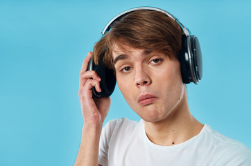 young man listening to music with headphones