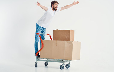 young man carrying cardboard boxes