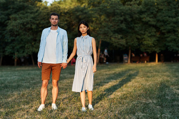 young couple walking in the park