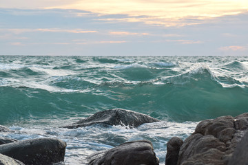  At the beach During the setting sun The wind blows cool. Beautiful clouds and rocks with sandy ground