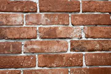 Obraz premium red and red brick wall close. Template for designers.