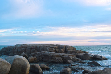  At the beach During the setting sun The wind blows cool. Beautiful clouds and rocks with sandy ground