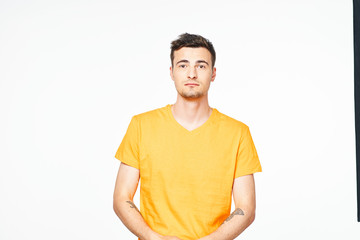 portrait of young man with arms crossed