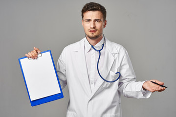 young doctor with clipboard