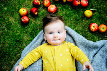 Fototapeta na wymiar infant boy with apples