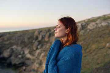 portrait of young woman on the background of blue sky