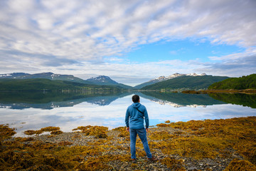 Fototapeta na wymiar One man stands to see the great nature in the north norway