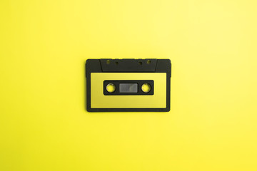 Fototapeta premium black cassette tape with yellow background