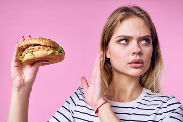 young woman with hamburger