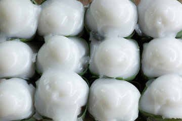 .Traditional Thai dessert, white appearance, wrapped with banana leaves