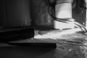 flashlight shining light on sump pump system