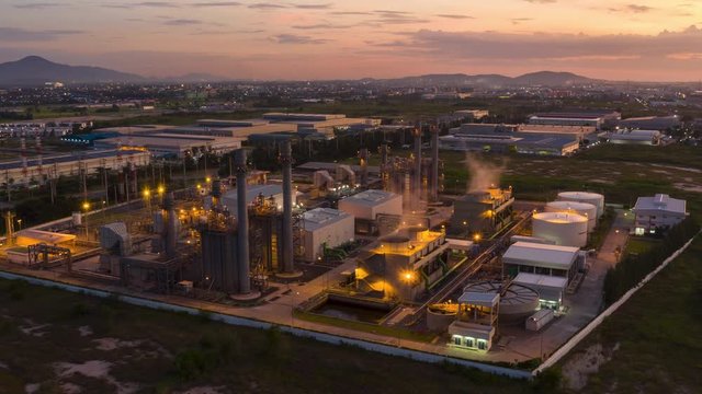 Hyper Timelapse Aerial view night light oil refinery terminal is industrial facility for storage of oil and petrochemical. oil manufacturing products. power electric plant. footage video 4k.