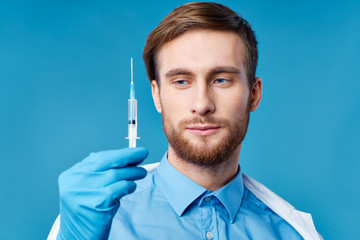 young doctor with syringe