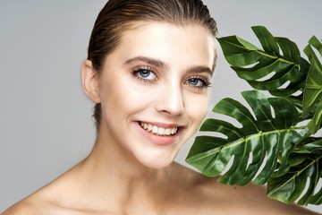 portrait of young woman with perfect skin and makeup