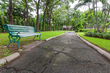 View of city park with exercise path surrounded by nature.