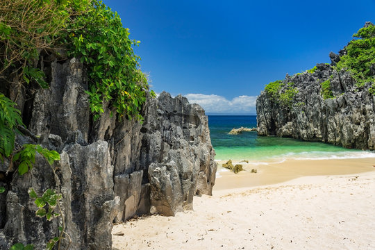 Limestone rock formation on Lahus Island beach in the municipality of Caramoan, Camarines Sur Province, Luzon in the Philippines, region for Survivor TV shows filming.
