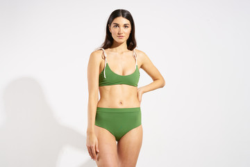 Fototapeta premium young woman in green bikini