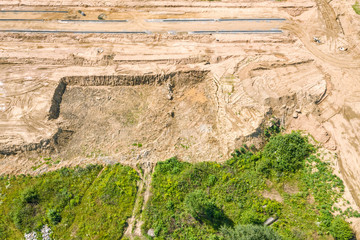 foundation excavation works on construction site. preparation of building foundation. industrial background. aerial view  