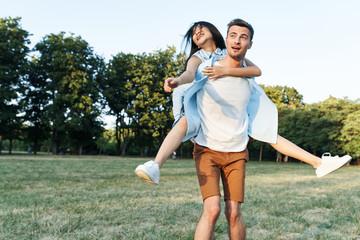 young couple running in the park