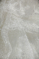 Details of the bride dress fabric and beautiful embroidery wedding concept used as a background for illustrations