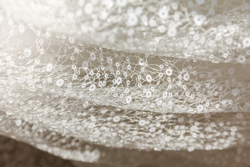 Details of the bride dress fabric and beautiful embroidery wedding concept used as a background for illustrations