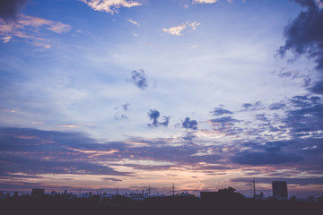 Romantic sunset sky with fluffy clouds and beautiful heavy weather landscape for use as background images