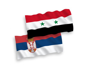 National vector fabric wave flags of Serbia and Syria isolated on white background. 1 to 2 proportion.