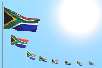 beautiful many South Africa flags placed diagonal on blue sky with place for your text - any feast flag 3d illustration..