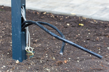 Electric wires on the ground in the park