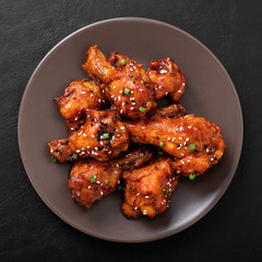 Baked chicken wings with sesame and sauce. Traditional asian recipe. 