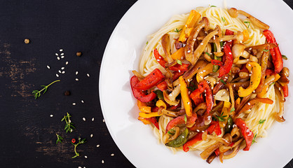 Noodles with shimeji mushrooms and paprika. Oriental meal. Japanese Shimeji mushroom stir fry. Top view