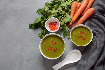 Healthy Vegan Creamy blended vegetable Soup puree with broccoli, celery, peas and carrots . Green...