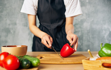 woman cutting vegetables in the kitchen