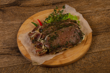 Raw marinated pork steak