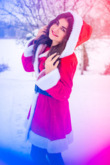 Arabic Santa girl at winter holidays, girl in costume 