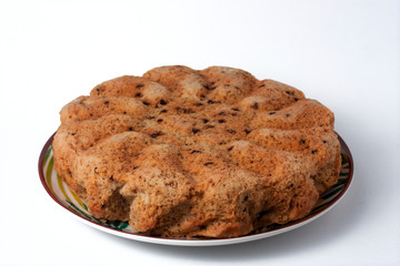 Donut with homemade chocolate beans on a white background