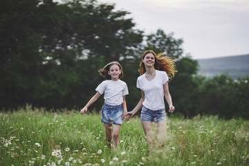 Fototapeta premium mother and daughter in the park