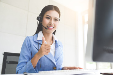 Call Center Service. Photo of customer support or sales agent.  Help line answering and telemarketing. Female caller or receptionist phone operator.Copy space for some text, advertising or slogan.