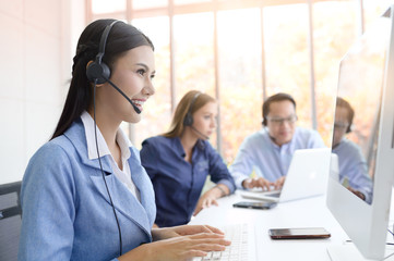 Call Center Service. Photo of customer support or sales agent.  Help line answering and telemarketing. Female caller or receptionist phone operator.Copy space for some text, advertising or slogan.