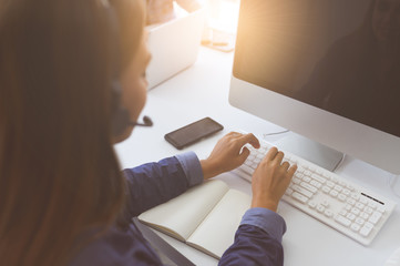 Call Center Service. Photo of customer support or sales agent.  Help line answering and telemarketing. Female caller or receptionist phone operator.Copy space for some text, advertising or slogan.