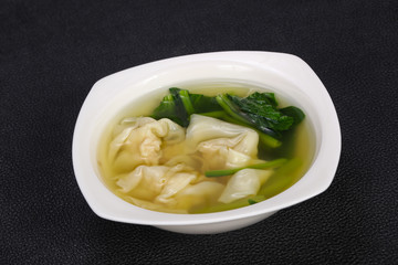 Asian traditional Wonton soup with herbs