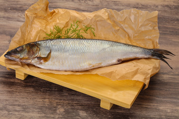 Salted herring over the wooden board