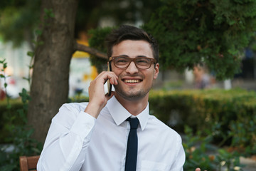 young businessman talking on mobile phone