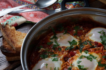 Shakshouka, Middle East and North Africa Dish of Poached Eggs in a Sauce of Tomatoes, Chili Peppers and Spices