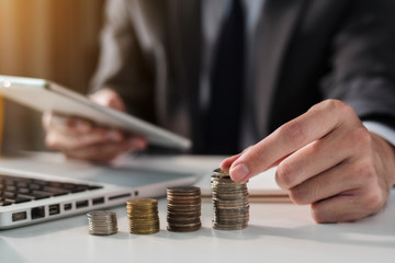 Businessman are calculating daily expenses in office.