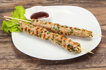 Minced pork skewer kebab with sauce